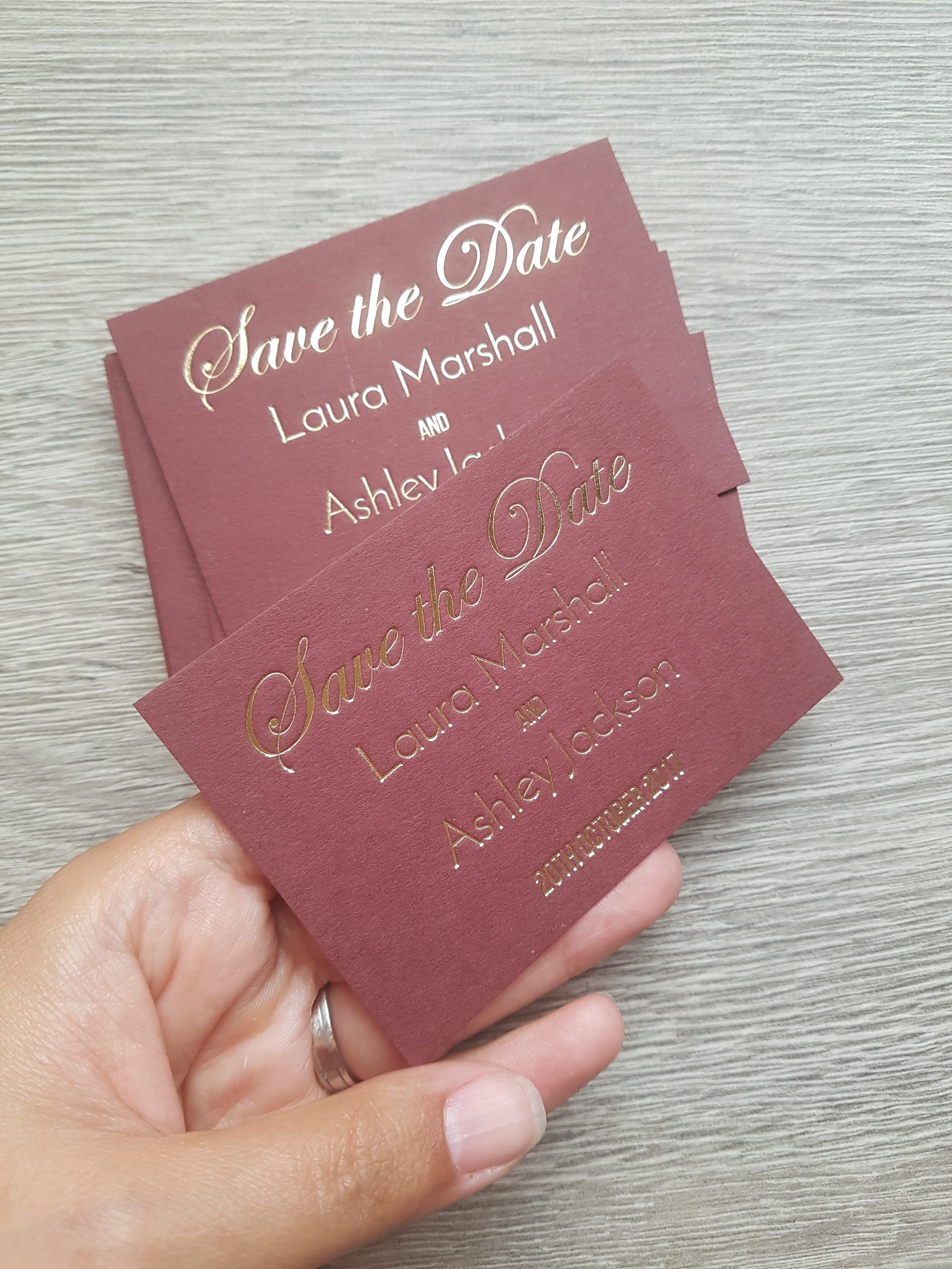 hot-foil-save-the-date-cards-on-burgundy-card-stock